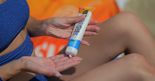 Applying SPF 50 sunscreen on the beach